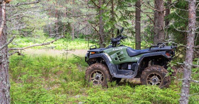 ATV parked in the woods
